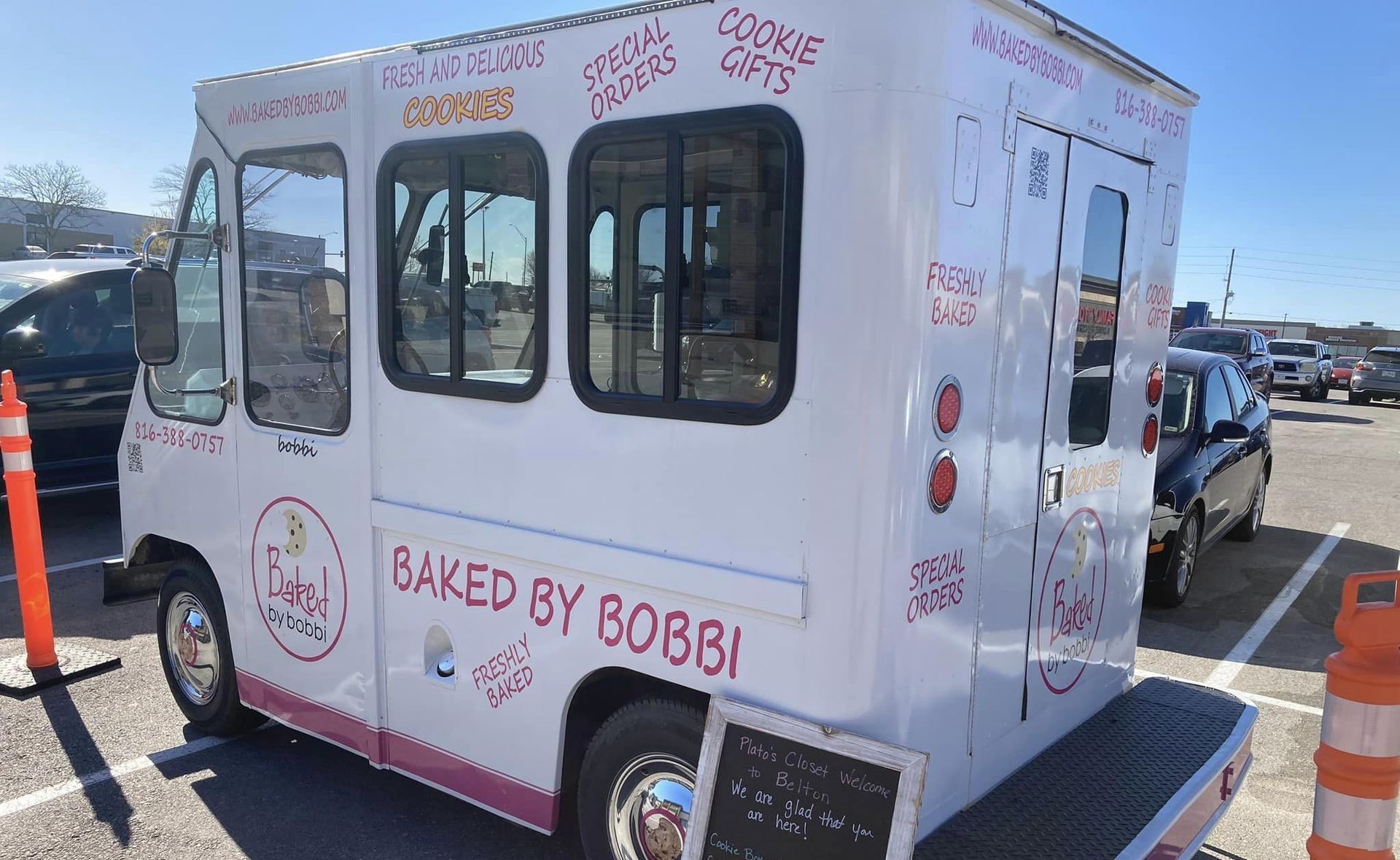 A baked by bobby food truck is parked in a parking lot