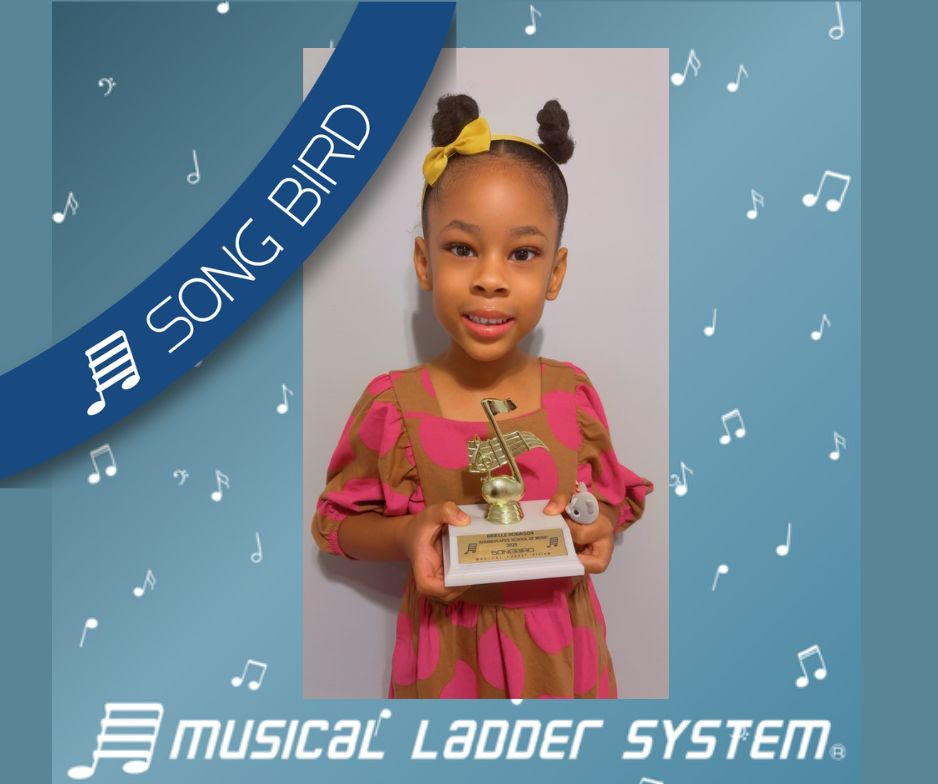 Brielle earned her certificate, wristband, and trophy for 6 months!