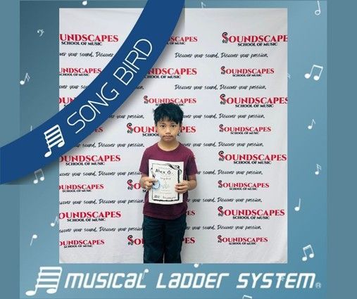 Alex earned his certificate and wristband for 6 months of piano lessons!