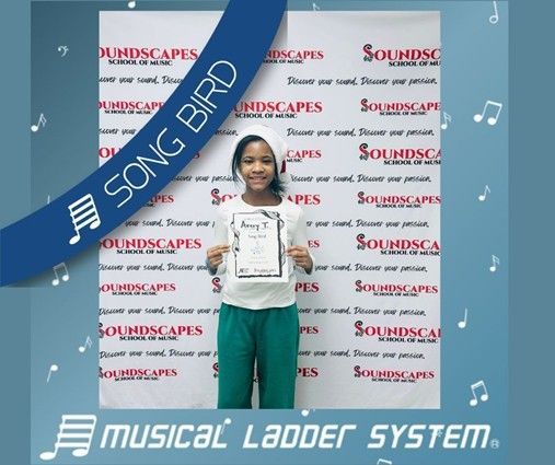 Avery earned her certificate, wristband, and trophy for 6 months of piano lessons!