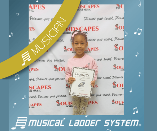 Bri earned her certificate and wristband for 9 months of piano lessons!
