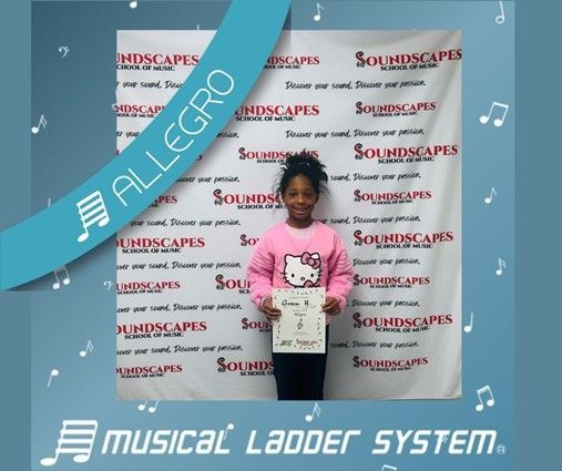 Grace earned her certificate and wristband for 15 months of violin lessons!