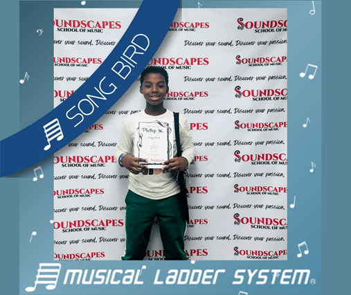 Phillip earned his certificate, wristband, and trophy for 6 months of piano lessons!
