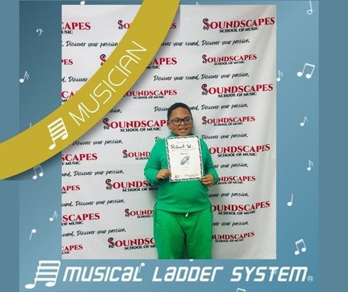 Robert earned his certificate and wristband for 9 months of piano lessons!