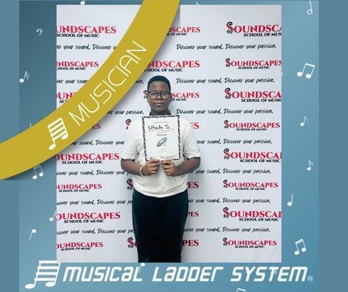 Utailo earned his certificate and wristband for 9 months of piano lessons!