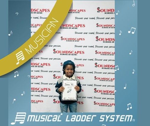 Zaire earned his certificate and wristband for 9 months of piano lessons!