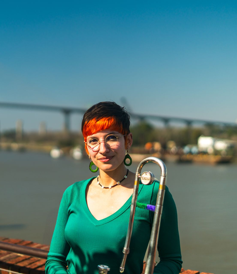 A man in a suit and bow tie is playing a violin. A man in a suit and bow tie is playing a violin.