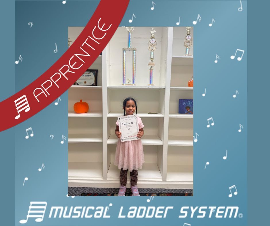 Amalia earned her certificate and wristband for 3 months of violin lessons!