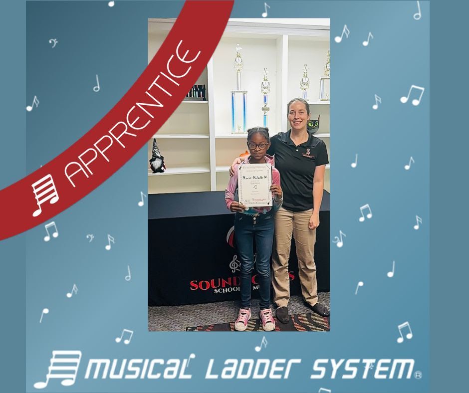 Marie-Michelle earned her certificate and wristband for 3 months of violin lessons!