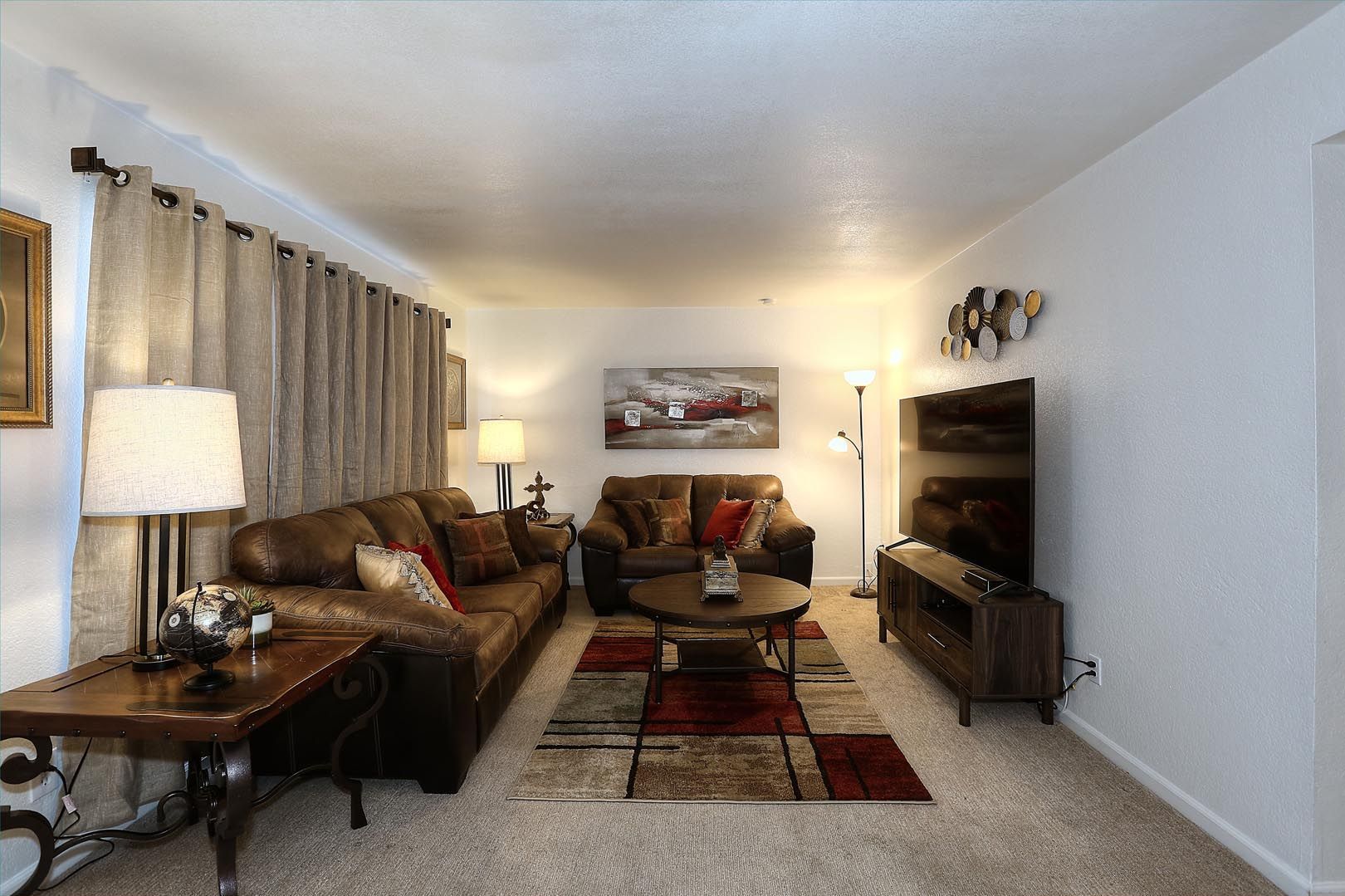 Great Room A living room filled with furniture and a flat screen tv.
