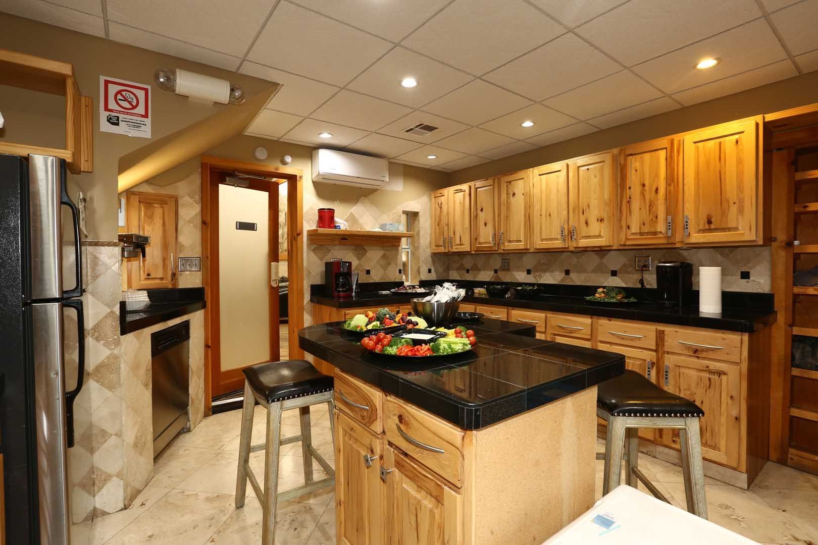 Kitchen A kitchen with wooden cabinets and black counter tops
