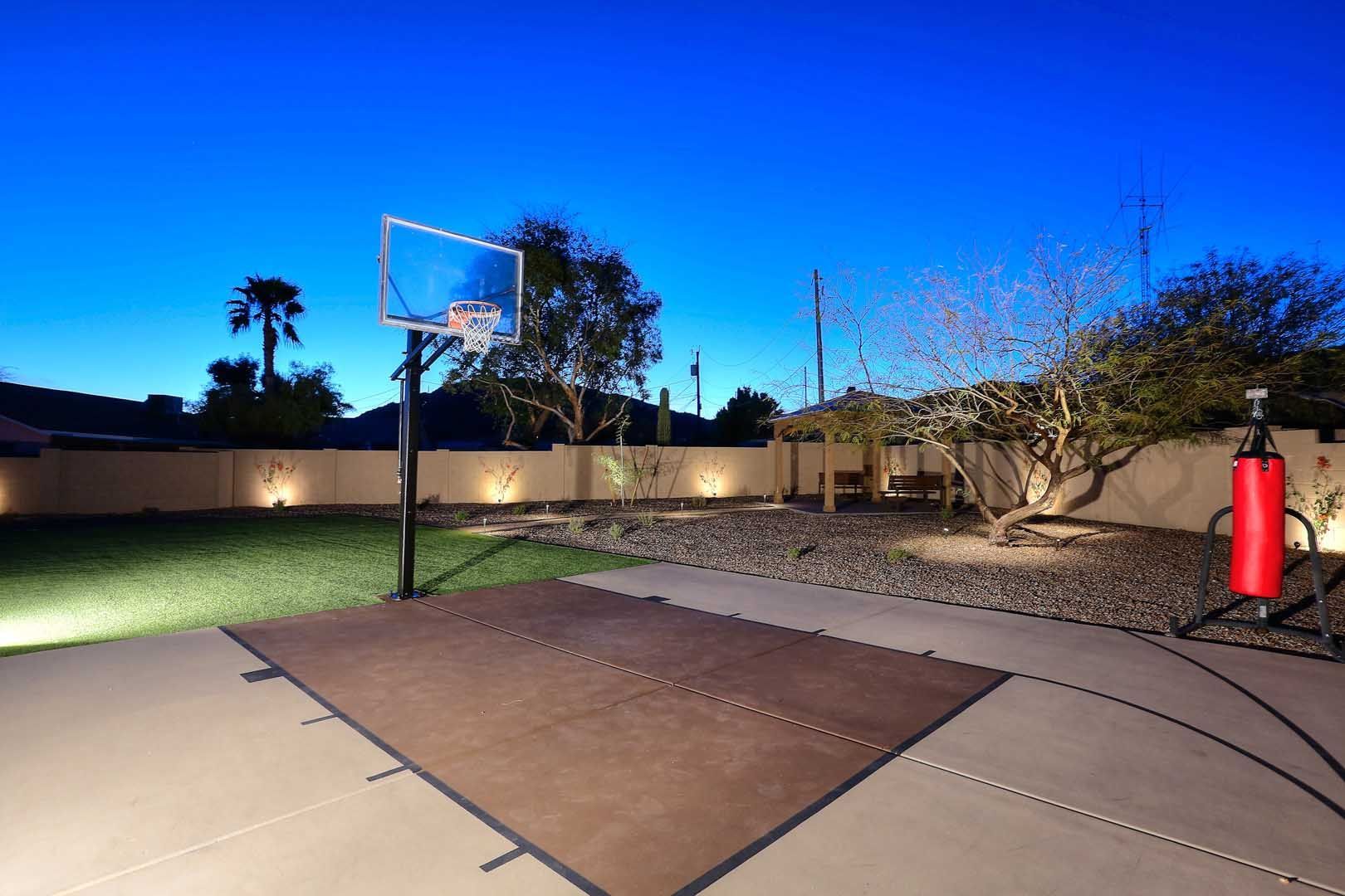 Night-Sport Court2-min A basketball hoop in a backyard at night