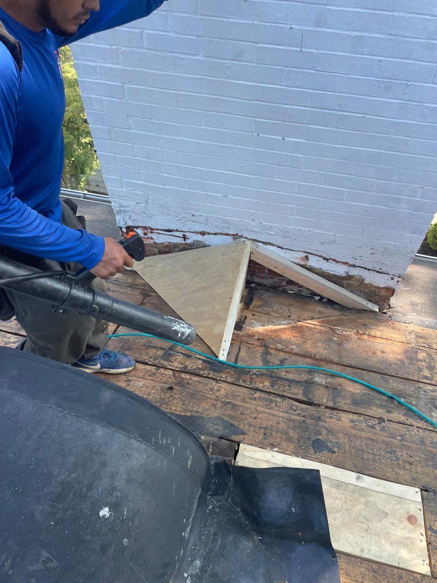 Worker Repairing the Roof