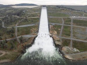 A drone provides an aerial view of the California Department of Water Resources first 2024 water release from the Lake Oroville flood control gates, as water flows over the four energy dissipator blocks at the end of the Lake Oroville Main Spillway in Butte County, California. Main spillway releases will continue to manage lake levels in anticipation of rain and snowmelt. Photo taken January 31, 2024.Picture
