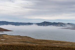 A view of fog traveling across the surface of Lake Oroville near the Oroville Dam, in Butte County, California.  On this date, the water storage was 2,008,215 acre-feet (AF), 59 percent of the total capacity. Photo taken December 20, 2024.Picture
