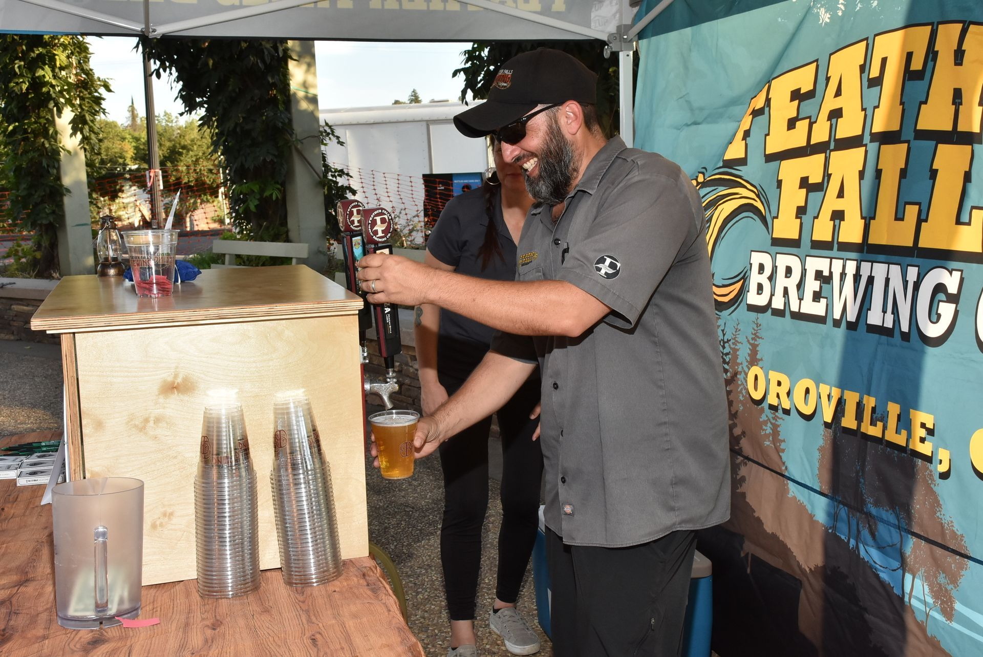 Feather Falls Brewing Company team pouring local craft beer for guests at the Oroville Economic Alliance Annual BBQ.