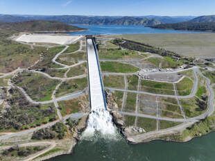 A drone view of Oroville Dam and main spillway at Lake Oroville in Butte County, California. Photo taken March 11, 2025.   On this date, the water storage was 2,881,527 acre-feet (AF), 84 percent of the total capacity. 