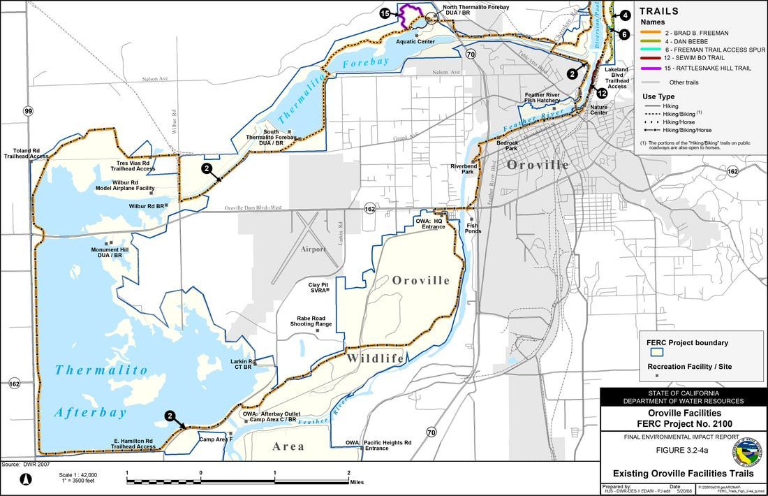 A black and white map of a lake with a city in the background.