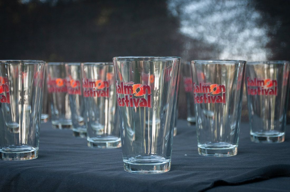 A bunch of empty glasses with the word festival on them