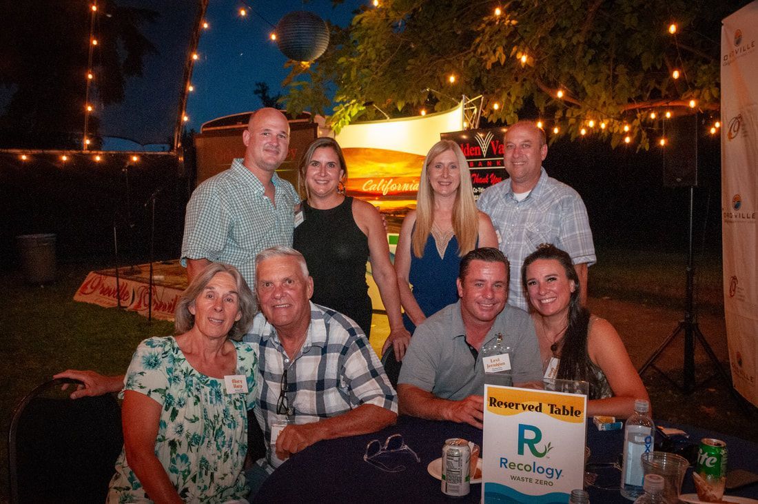 A group of people are posing for a picture at a party.