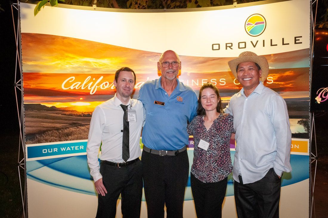 A group of people standing in front of a sign that says oroville