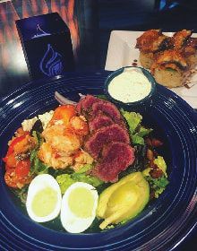 A close up of a plate of food on a table.