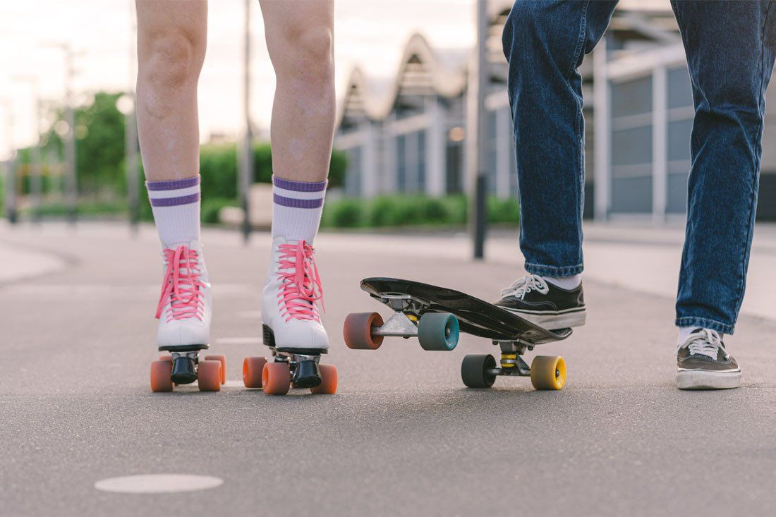 Woman is Rollerblading and a Man is Riding a Skateboard — MoneySmith Group In Kingscliff, NSW