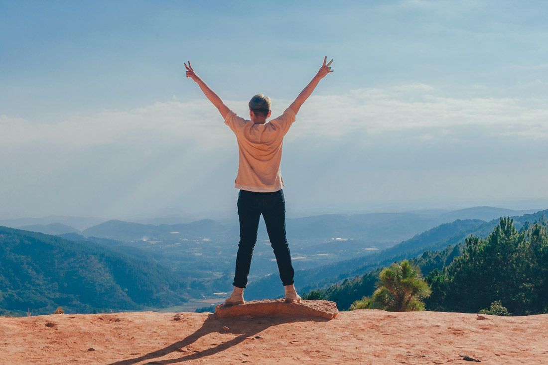 A Woman is Standing on Top of a Mountain — MoneySmith Group In Kingscliff, NSW