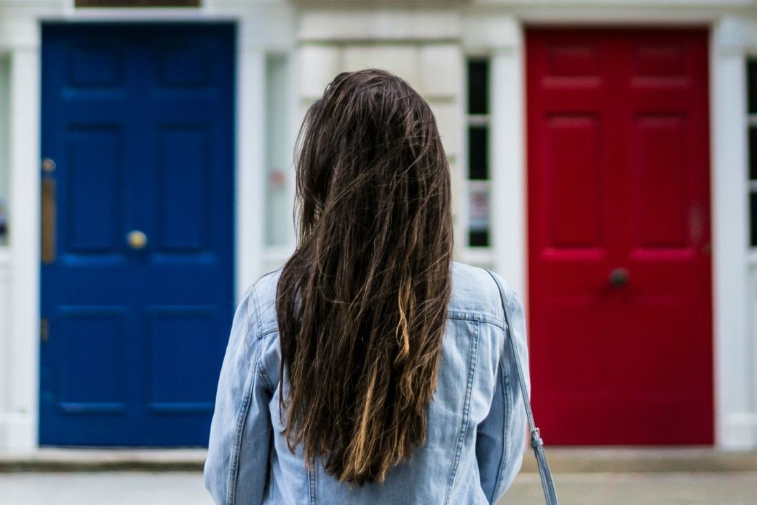 A Woman is Standing in Front of a Door — MoneySmith Group In Kingscliff, NSW