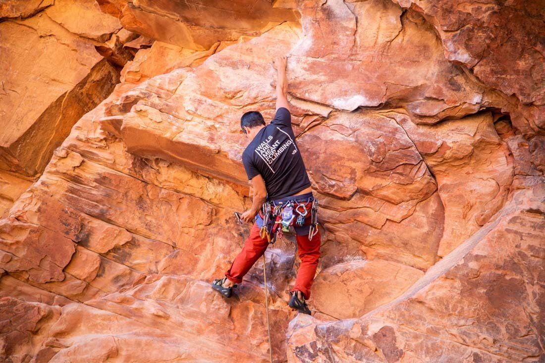 Man is Climbing Up a Rock Wall — MoneySmith Group In Kingscliff, NSW