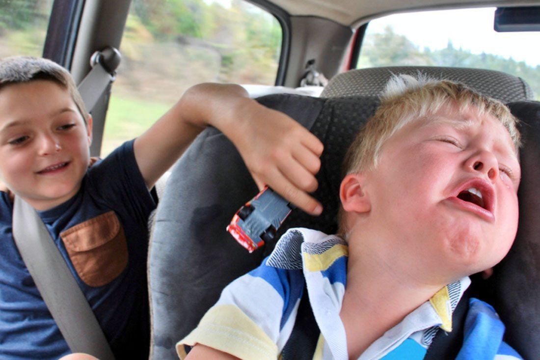 Two Boys Are Sitting in a Car and One is Crying — MoneySmith Group In Kingscliff, NSW