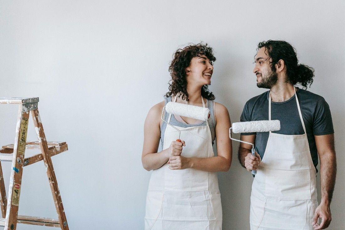 A Man and a Woman Are Standing Next to Each Other — MoneySmith Group In Kingscliff, NSW