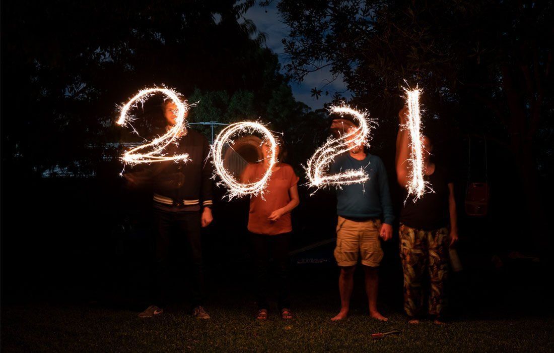 Group of People Are Holding Sparklers — MoneySmith Group In Kingscliff, NSW
