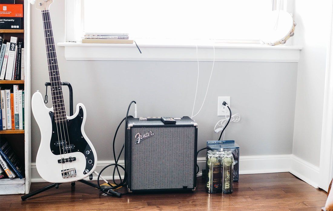 A White Electric Guitar and Amplifier — MoneySmith Group In Kingscliff, NSW