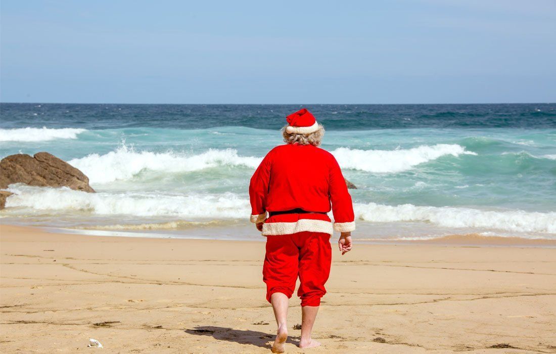 Man Dressed as Santa Claus is Walking on the Beach — MoneySmith Group In Kingscliff, NSW