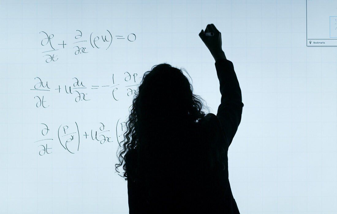 Woman is Writing a Math Problem on a Whiteboard — MoneySmith Group In Kingscliff, NSW