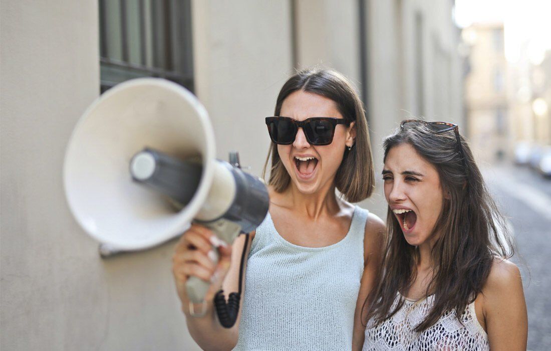 Two Women Are Standing Next to Each Other — MoneySmith Group In Kingscliff, NSW