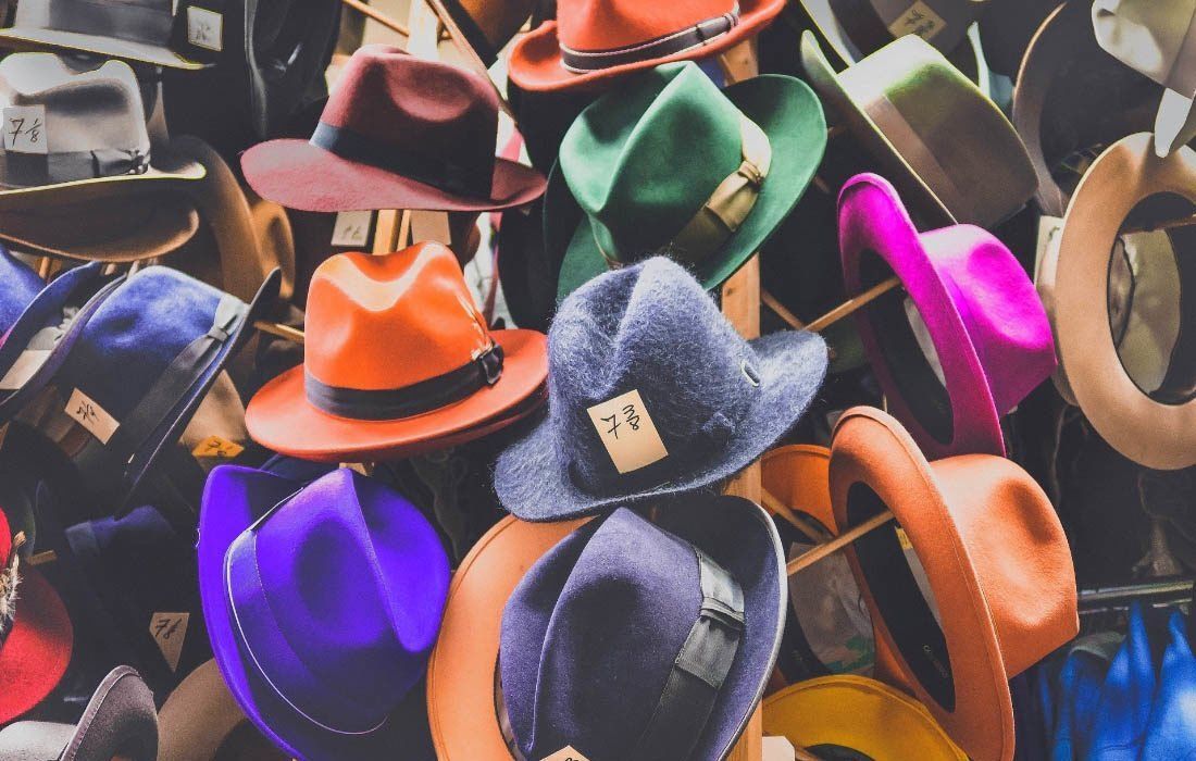 Colorful Hats Are Stacked on Top of Each Other — MoneySmith Group In Kingscliff, NSW