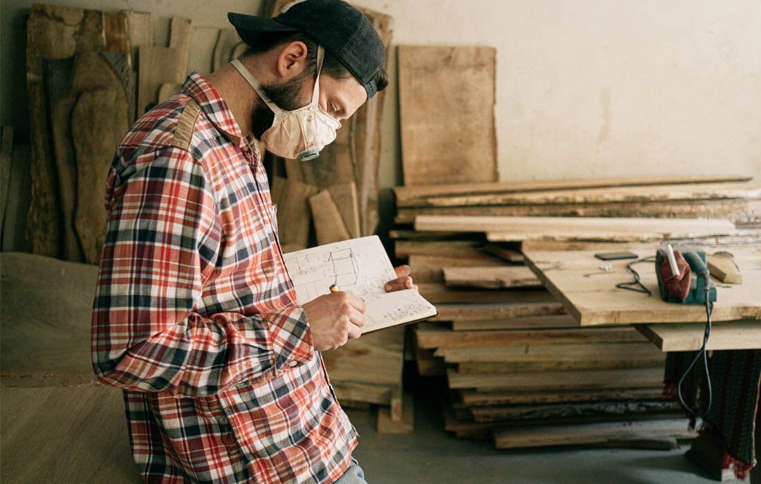 A Man is Looking at a Piece of Paper — MoneySmith Group In Kingscliff, NSW