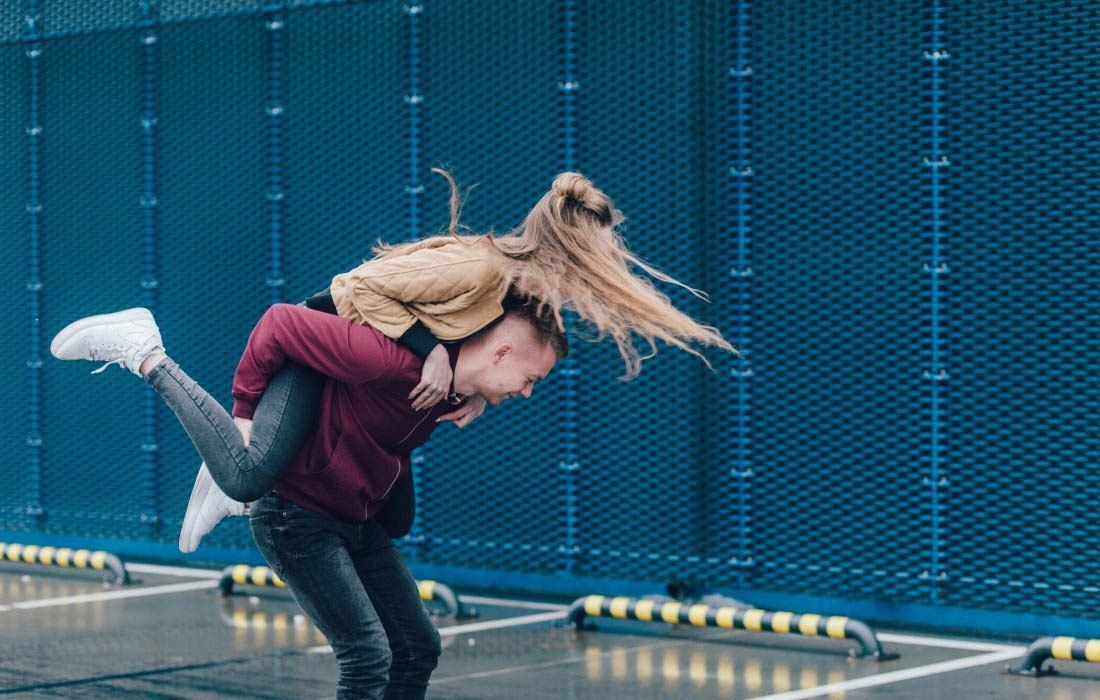 A Man is Carrying a Woman on His Back — MoneySmith Group In Kingscliff, NSW