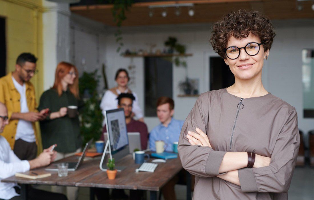 Woman is Standing With Her Arms Crossed — MoneySmith Group In Kingscliff, NSW