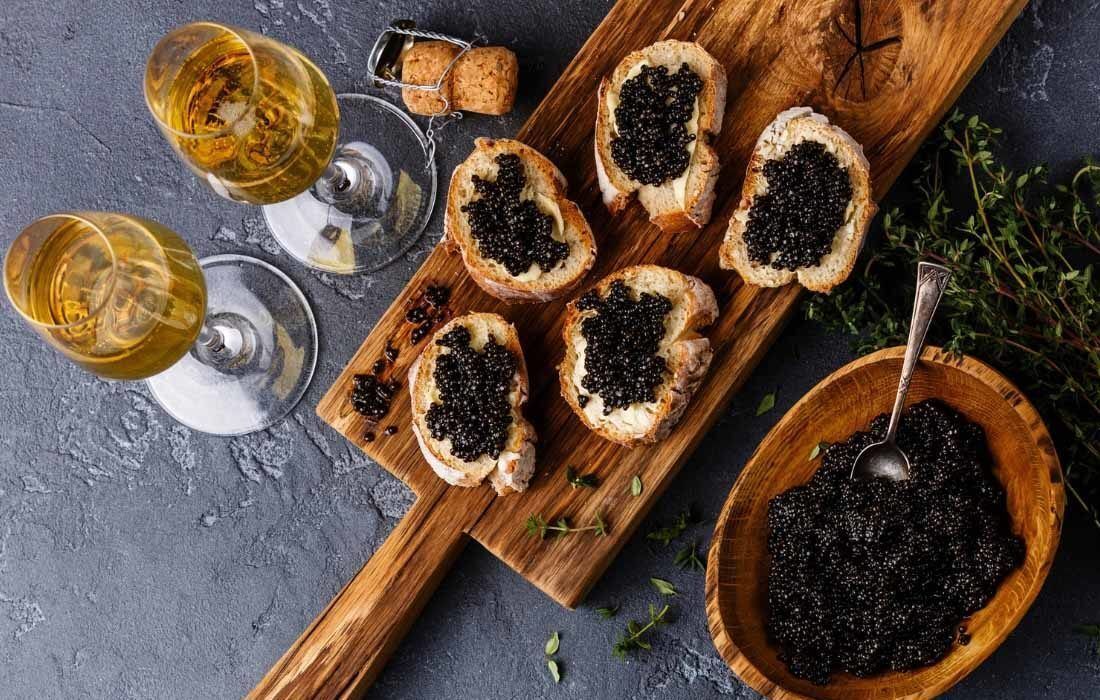 A Cutting Board Topped With Slices of Bread and Caviar — MoneySmith Group In Kingscliff, NSW