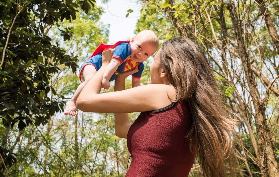 A Woman is Holding a Baby — MoneySmith Group In Kingscliff, NSW