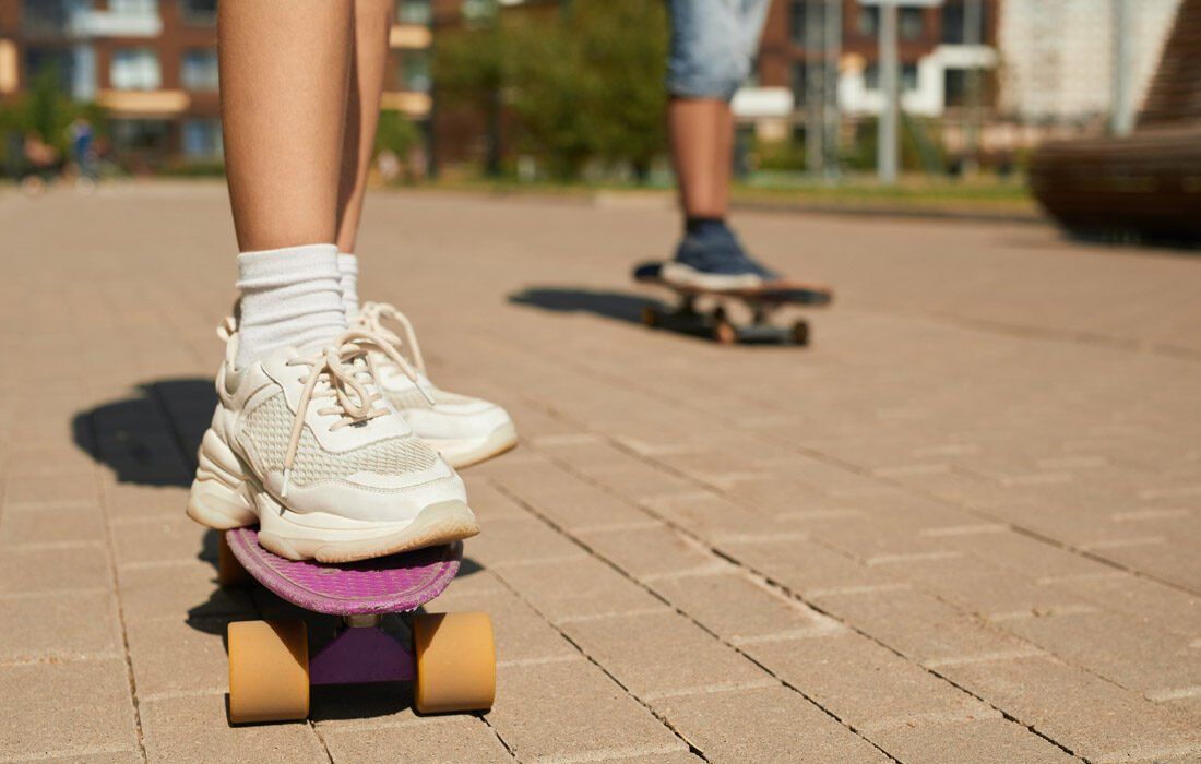 Person is Riding a Skateboard on a Sidewalk — MoneySmith Group In Kingscliff, NSW