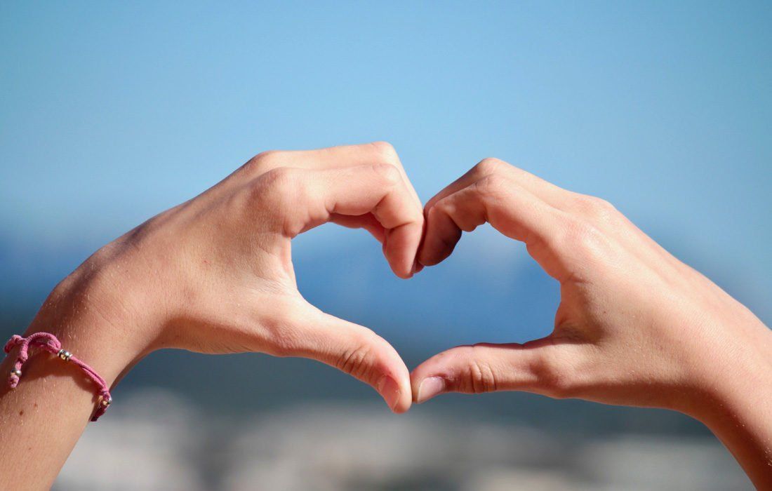 A Person is Making a Heart Shape — MoneySmith Group In Kingscliff, NSW