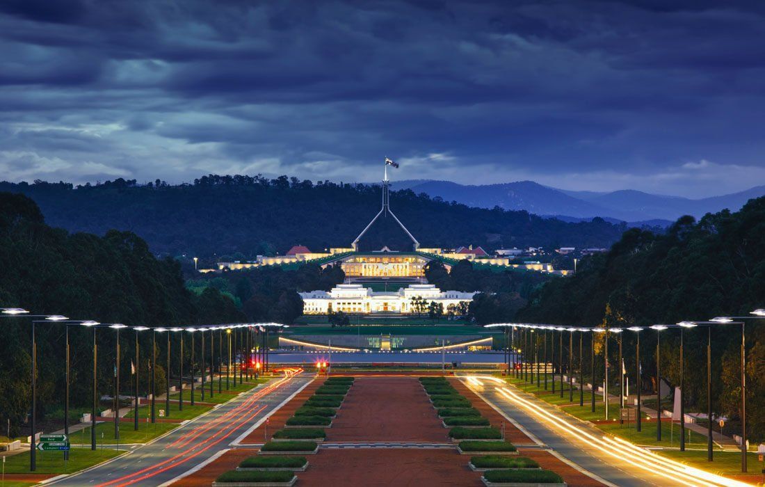 Australian Parliament Building is Lit Up at Night — MoneySmith Group In Kingscliff, NSW