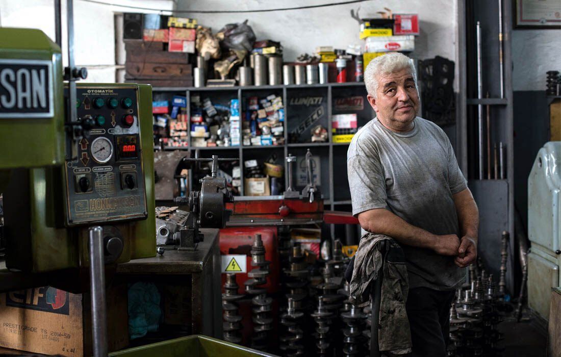 A Man is Standing in Front of a Machine — MoneySmith Group In Kingscliff, NSW