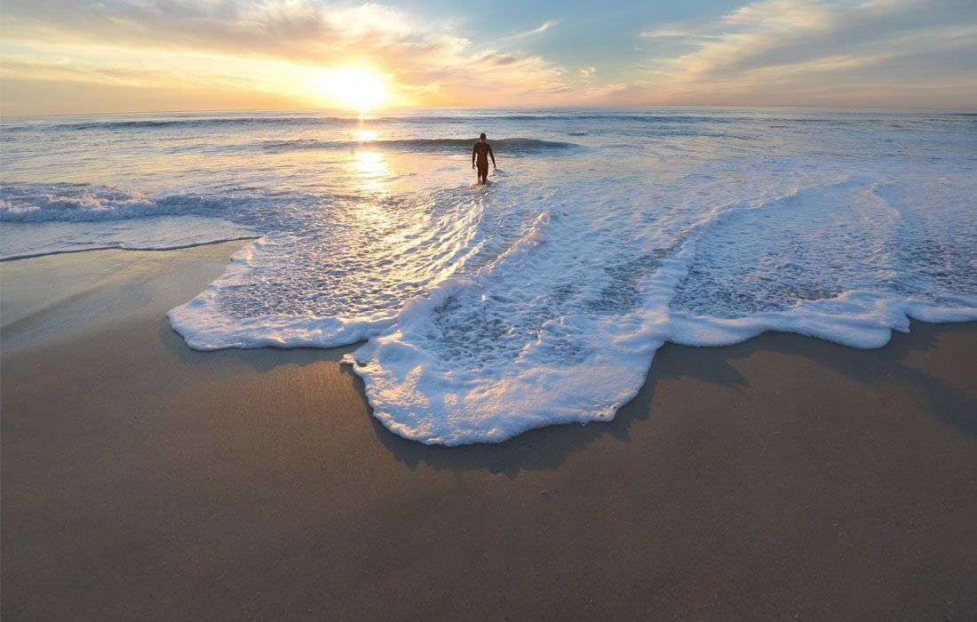 A Person is Standing on a Beach — MoneySmith Group In Kingscliff, NSW