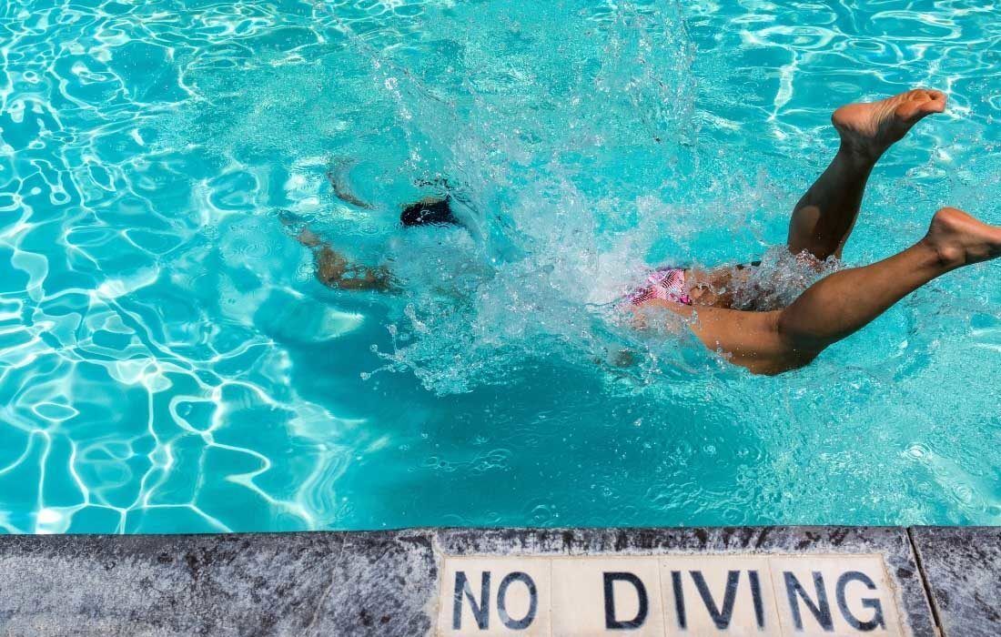A Person is Diving Into a Swimming Pool Background — MoneySmith Group In Kingscliff, NSW