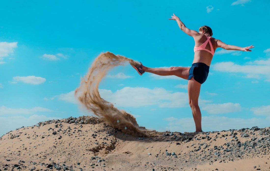 A Woman is Kicking Sand in the Air — MoneySmith Group In Kingscliff, NSW